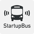 A light grey rectangle with a black
										  front of a bus with wave like lines on
										  the side. Below the bus is written
										  StartupBus.